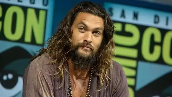 Which superhero does he play in movies based on DC comics? Aquaman, Batman, Superman, Flash